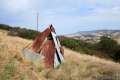 A corrugated metal teepee along the trail