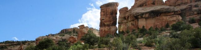 Devils Kitchen Trail is located near the south end of Colorado National Monument at the bottom of rugged No Thoroughfare Canyon. This 1.2-mile hike ascends 225 feet to visits an intriguing rock formation on the side of the canyon where tall boulders have enclosed a rock grotto