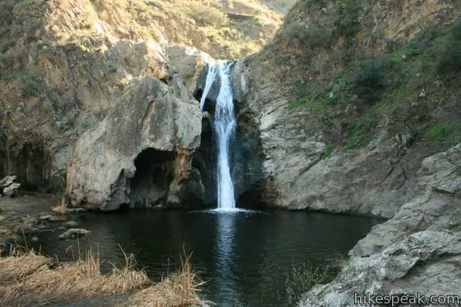 This 40-foot waterfall drops into a cattail-lined pool in Wildwood Park.