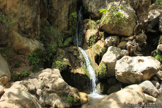 This easy and level 2.6-mile out and back hike visits the ruins of a burned down ranch and a small waterfall.